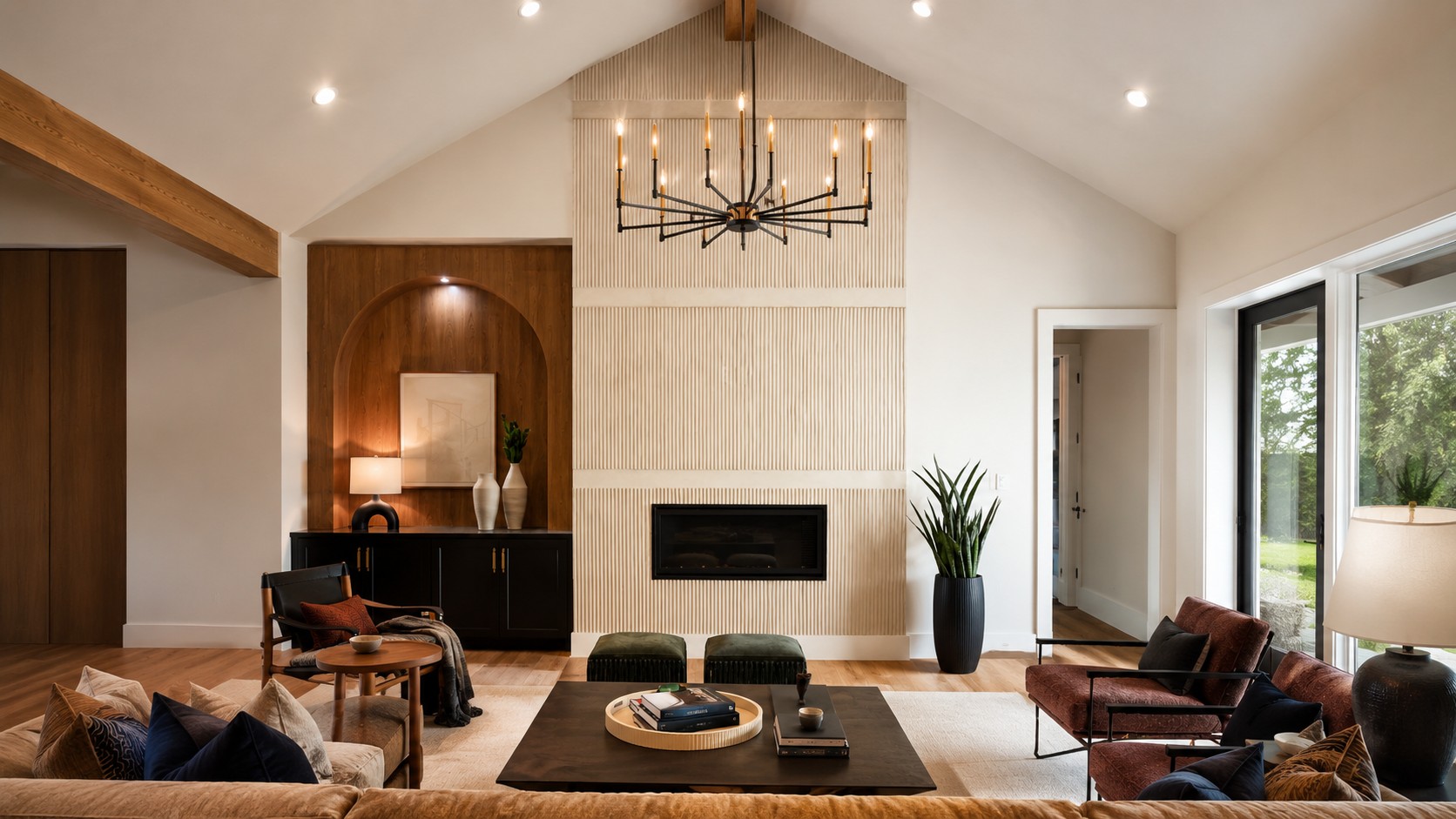 Living room with a fluted plaster chimney, fireplace and chandelier.