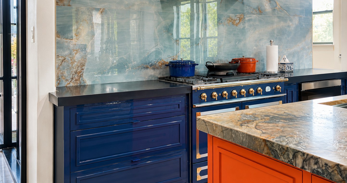 Kitchen with deep navy high gloss cabinets and brass accents.