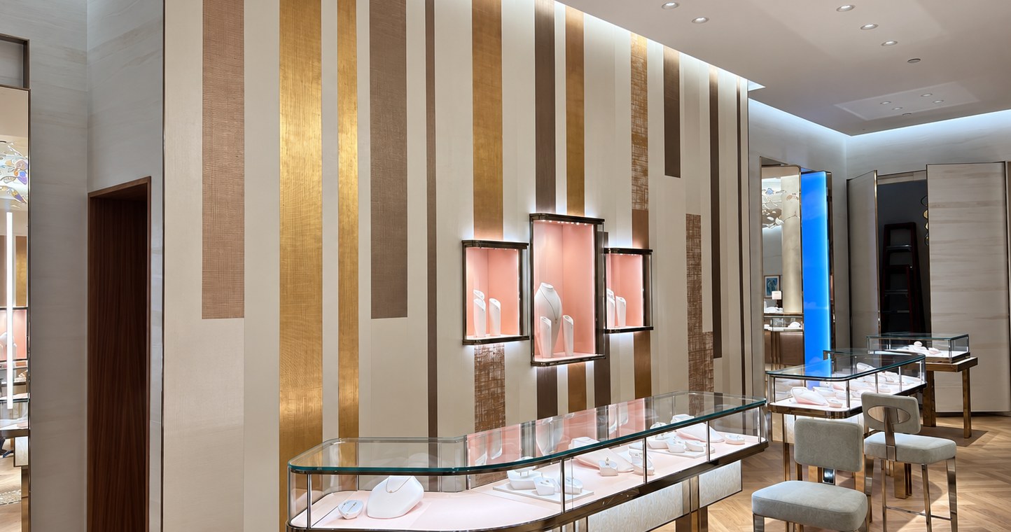 Decorative wall bands and illuminated display cases in a retail interior.
