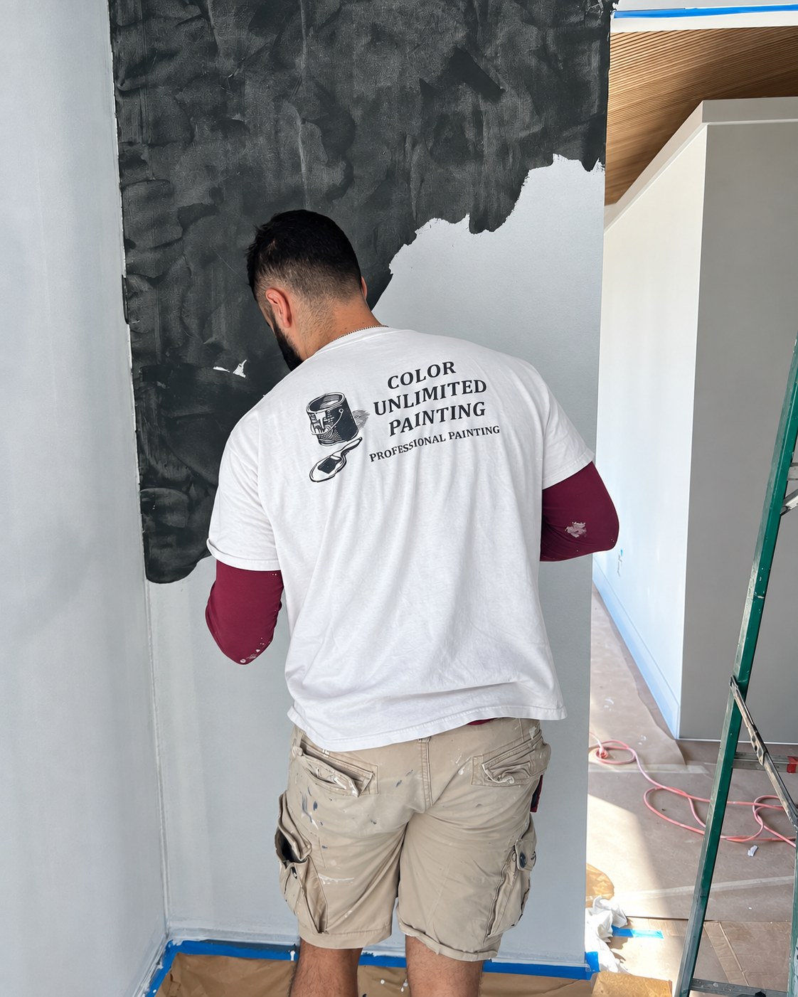 Color Unlimited worker during wall preparation.