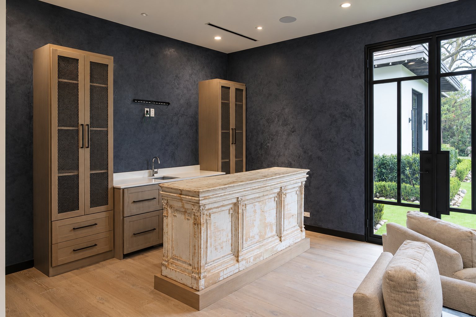 Dark wet bar with timber cabinetry and a distressed antique bar front.