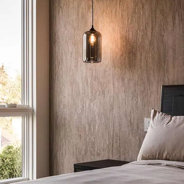 Meoded example of textured Marmorino Palladino plaster on a bedroom wall.